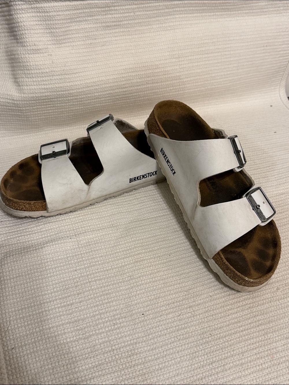Birkenstock White Arizona Two-Strap Sandals with Silver Buckles